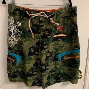 Live Mechanics Green/Blue Board Shorts with Drawstring Waist Camo Lion design.
